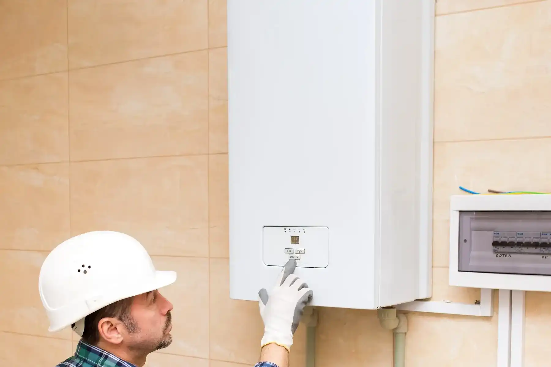 Engineer working on a domestic water heater — Worksop