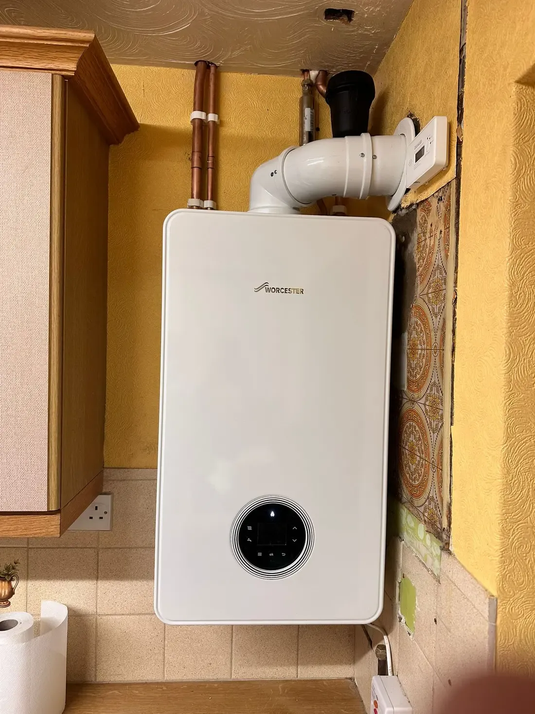 Worcester Bosch combi boiler installed in a fitted kitchen